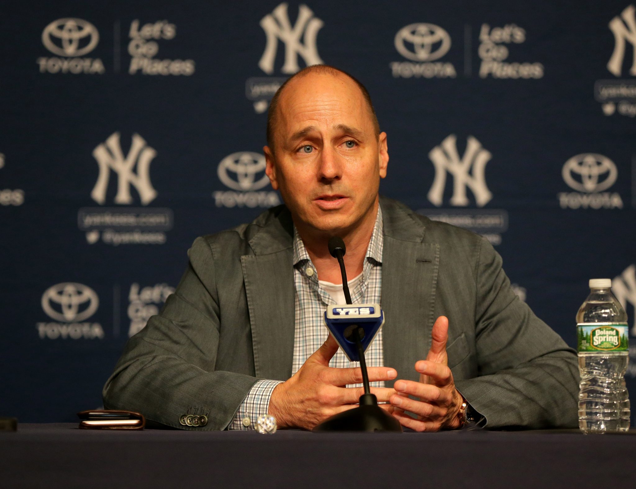 Aug 7, 2016; Bronx, NY, USA; New York Yankees general manager Brian Cashman addresses the media during a press conference announcing the retirement of designated hitter Alex Rodriguez prior to the game between the Cleveland Indians and New York Yankees at Yankee Stadium. Rodriguez will play his last game on Friday August 12, 2016. Mandatory Credit: Andy Marlin-USA TODAY Sports