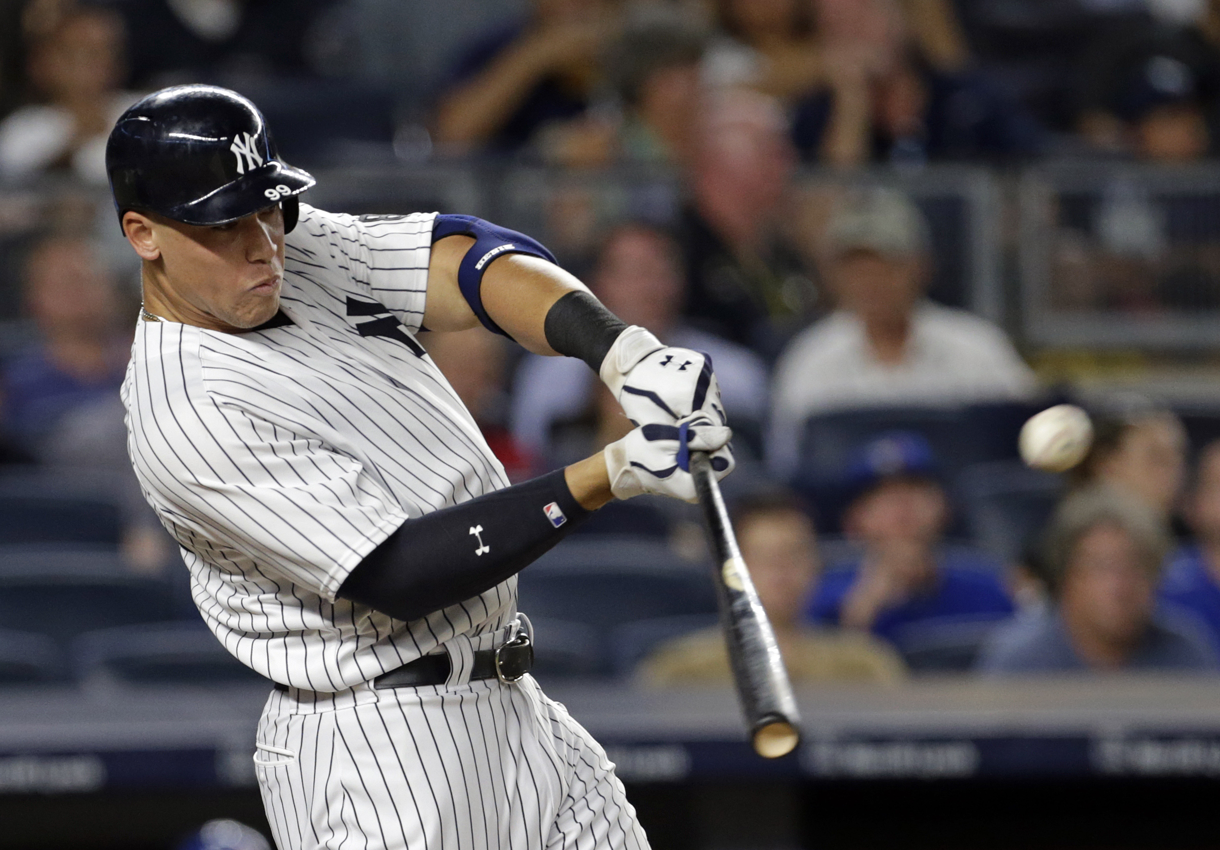 Aug 15, 2016; Bronx, NY, USA; New York Yankees right fielder Aaron Judge (99) hits an RBI double during the fourth inning against the Toronto Blue Jays at Yankee Stadium. Mandatory Credit: Adam Hunger-USA TODAY Sports