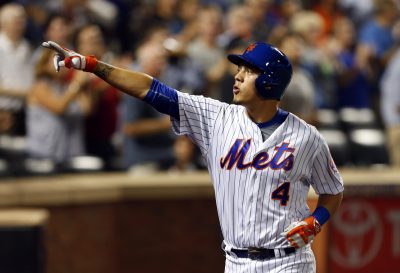 Aug 31, 2016; New York City, NY, USA; New York Mets third baseman Wilmer Flores (4) reacts on his way to the dugout after hitting a two run home run in the second inning against the Miami Marlins at Citi Field. Mandatory Credit: Noah K. Murray-USA TODAY Sports