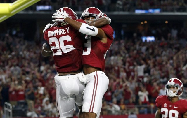 Sep 3, 2016; Arlington, TX, USA; Alabama Crimson Tide defensive back Marlon Humphrey (26) celebrates with teammates after intercepting a ball for a touchdown during the first half against the USC Trojans at AT&T Stadium. Mandatory Credit: Tim Heitman-USA TODAY Sports