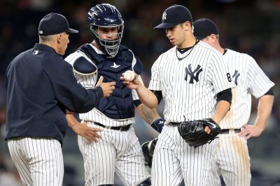 Sep 6, 2016; Bronx, NY, USA; New York Yankees starting pitcher Luis Cessa (85) hands the ball to New York Yankees manager Joe Girardi (28) after being removed from the game again the Toronto Blue Jays during the sixth inning at Yankee Stadium. Mandatory Credit: Brad Penner-USA TODAY Sports