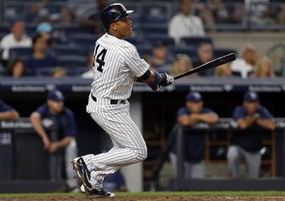 Sep 9, 2016; Bronx, NY, USA; New York Yankees second baseman Starlin Castro (14) hits a single during the first inning against the Tampa Bay Rays at Yankee Stadium. Mandatory Credit: Adam Hunger-USA TODAY Sports