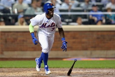 Sep 20, 2016; New York City, NY, USA; New York Mets third baseman Jose Reyes (7) hits a triple against the Atlanta Braves during the third inning at Citi Field. Mandatory Credit: Brad Penner-USA TODAY Sports