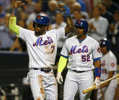 Sep 21, 2016; New York City, NY, USA; New York Mets third baseman Jose Reyes (7) reacts after scoring on a home run by New York Mets shortstop Asdrubal Cabrera (13) (not pictured) in the first inning against the Atlanta Braves at Citi Field. Mandatory Credit: Noah K. Murray-USA TODAY Sports