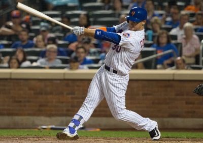 Sep 23, 2016; New York City, NY, USA; New York Mets left fielder Michael Conforto (30) hits a three RBI home run against the Philadelphia Phillies during the fifth inning at Citi Field. Mandatory Credit: Bill Streicher-USA TODAY Sports