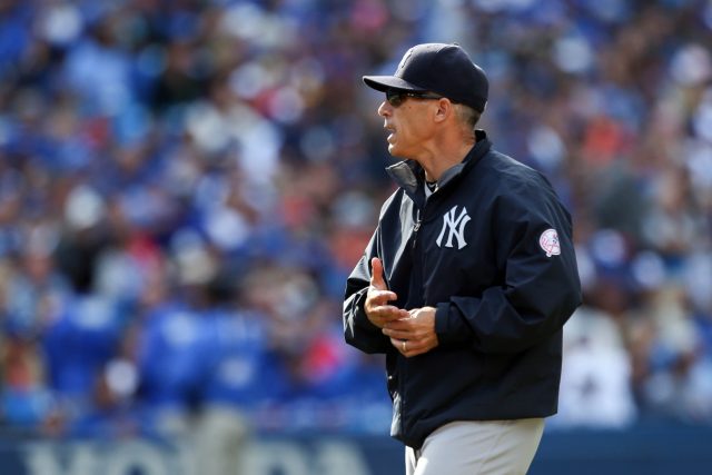 Sep 25, 2016; Toronto, Ontario, CAN; New York Yankees manager Joe Girardi (28) exchanges words with the ump in the ninth inning against Toronto Blue Jays at Rogers Centre. Blue Jays beat Yankees 4-3.Mandatory Credit: Kevin Sousa-USA TODAY Sports