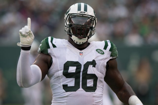 Oct 2, 2016; East Rutherford, NJ, USA; New York Jets defensive end Muhammad Wilkerson (96) celebrates after a blocked pass in the second half at MetLife Stadium. Seattle Seahawks defeat the New York Jets 27-17. Mandatory Credit: William Hauser-USA TODAY Sports