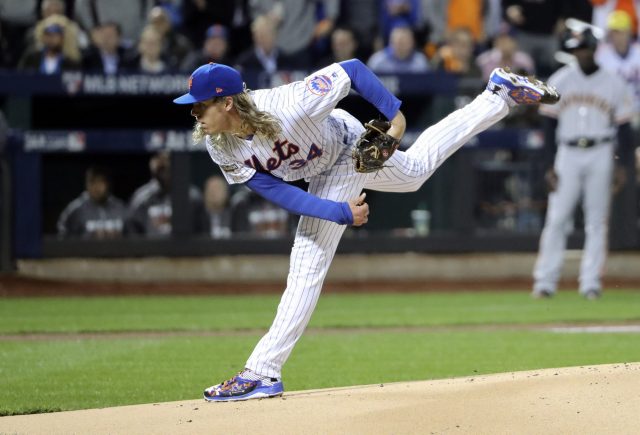 Oct 5, 2016; New York City, NY, USA; New York Mets starting pitcher Noah Syndergaard (34) throws during the first inning against the San Francisco Giants in the National League wild card playoff baseball game at Citi Field. Mandatory Credit: Anthony Gruppuso-USA TODAY Sports