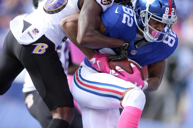 Oct 16, 2016; East Rutherford, NJ, USA; New York Giants wide receiver Roger Lewis (82) catches a touchdown pass against Baltimore Ravens corner back Tavon Young (36) during the second quarter at MetLife Stadium. Mandatory Credit: Brad Penner-USA TODAY Sports