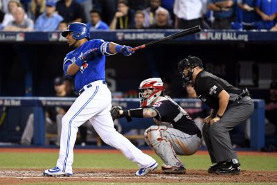 Oct 18, 2016; Toronto, Ontario, CAN; Toronto Blue Jays first baseman Edwin Encarnacion (10) hits an two RBI single during the seventh inning against the Cleveland Indians in game four of the 2016 ALCS playoff baseball series at Rogers Centre. Mandatory Credit: Nick Turchiaro-USA TODAY Sports