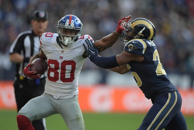 Oct 23, 2016; London, United Kingdom; New York Giants receiver Victor Cruz (80) is defended by Los Angeles Rams strong safety T.J. McDonald (25) on a 25-yard reception during game 16 of the NFL International Series at Twickenham Stadium. Mandatory Credit: Kirby Lee-USA TODAY Sports