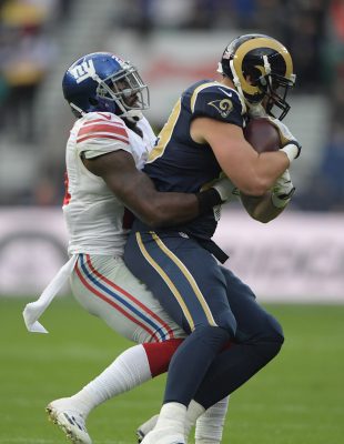 Oct 23, 2016; London, United Kingdom; New York Giants linebacker Keenan Robinson (57) tackles Los Angeles Rams tight end Tyler Higbee (89) during game 16 of the NFL International Series at Twickenham Statdium. The Giants defeated the Rams 17-10. Mandatory Credit: Kirby Lee-USA TODAY Sports