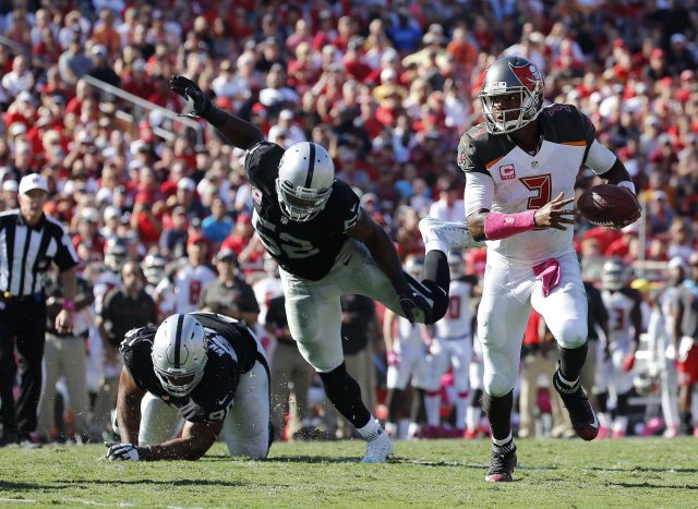 Oct 30, 2016; Tampa, FL, USA; Tampa Bay Buccaneers quarterback Jameis Winston (3) runs past Oakland Raiders defensive end Khalil Mack (52) during the second half at Raymond James Stadium. Oakland Raiders defeated the Tampa Bay Buccaneers 30-24 in overtime. Mandatory Credit: Kim Klement-USA TODAY Sports