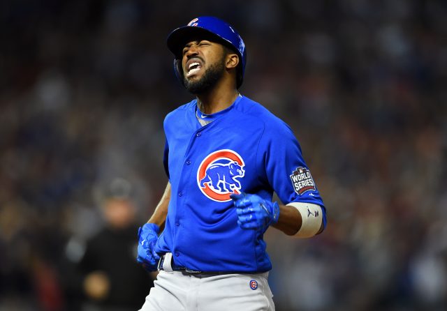 Nov 2, 2016; Cleveland, OH, USA; Chicago Cubs center fielder Dexter Fowler (24) celebrates after hitting a solo home run against the Cleveland Indians in the first inning in game seven of the 2016 World Series at Progressive Field. Mandatory Credit: Tommy Gilligan-USA TODAY Sports