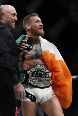 Nov 12, 2016; New York, NY, USA; Conor McGregor (blue gloves) with his championship belt after defeating Eddie Alvarez (red gloves) in their lightweight title bout during UFC 205 at Madison Square Garden. Mandatory Credit: Adam Hunger-USA TODAY Sports
