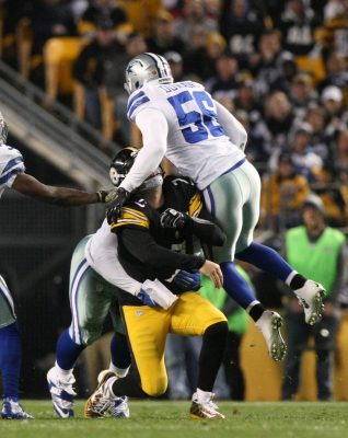 Nov 13, 2016; Pittsburgh, PA, USA; Pittsburgh Steelers quarterback Ben Roethlisberger (7) is hit from behind and from Dallas Cowboys linebacker Justin Durant (56) as he throws a pass against the Dallas Cowboys during the first half of their game at Heinz Field. Mandatory Credit: Jason Bridge-USA TODAY Sports