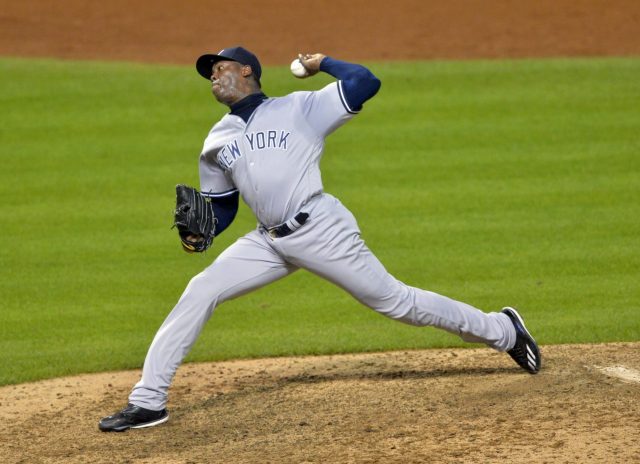 Jul 7, 2016; Cleveland, OH, USA; New York Yankees relief pitcher Aroldis Chapman (54) delivers in the ninth inning against the Cleveland Indians at Progressive Field. Mandatory Credit: David Richard-USA TODAY Sports