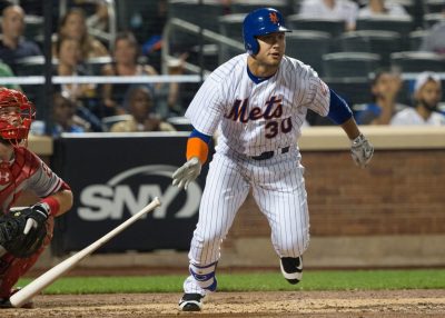 Sep 23, 2016; New York City, NY, USA; New York Mets left fielder Michael Conforto (30) hits a double against the Philadelphia Phillies during the second inning at Citi Field. Mandatory Credit: Bill Streicher-USA TODAY Sports