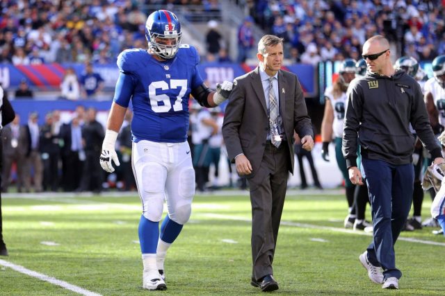 Nov 6, 2016; East Rutherford, NJ, USA; New York Giants guard Justin Pugh (67) is helped off the field after spraining a knee during the second quarter against the Philadelphia Eagles at MetLife Stadium. Mandatory Credit: Brad Penner-USA TODAY Sports