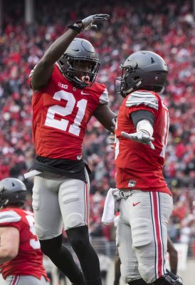 Nov 26, 2016; Columbus, OH, USA; Ohio State Buckeyes wide receiver Parris Campbell (21) congratulates Ohio State Buckeyes quarterback J.T. Barrett (16) on his touchdown against the Michigan Wolverines at Ohio Stadium. Ohio State won the game 30-27 in double overtime. Mandatory Credit: Greg Bartram-USA TODAY Sports