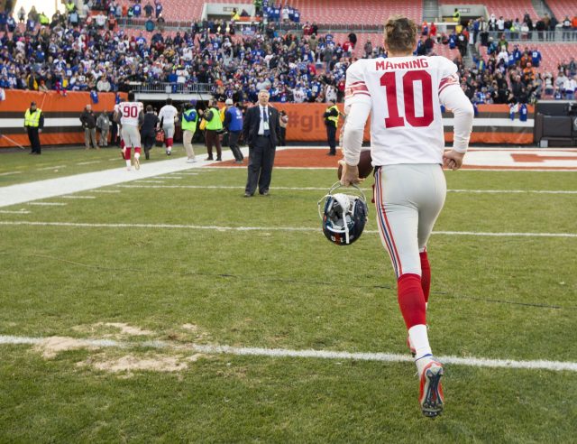 Nov 27, 2016; Cleveland, OH, USA; New York Giants quarterback Eli Manning (10) walks off the field after the game against the Cleveland Browns at FirstEnergy Stadium. The Giants won 27-13. Mandatory Credit: Scott R. Galvin-USA TODAY Sports