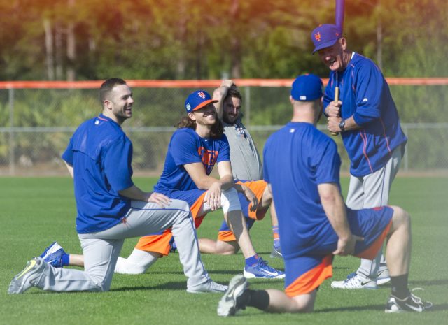 New York Mets' David Wright, center, slides into third base after