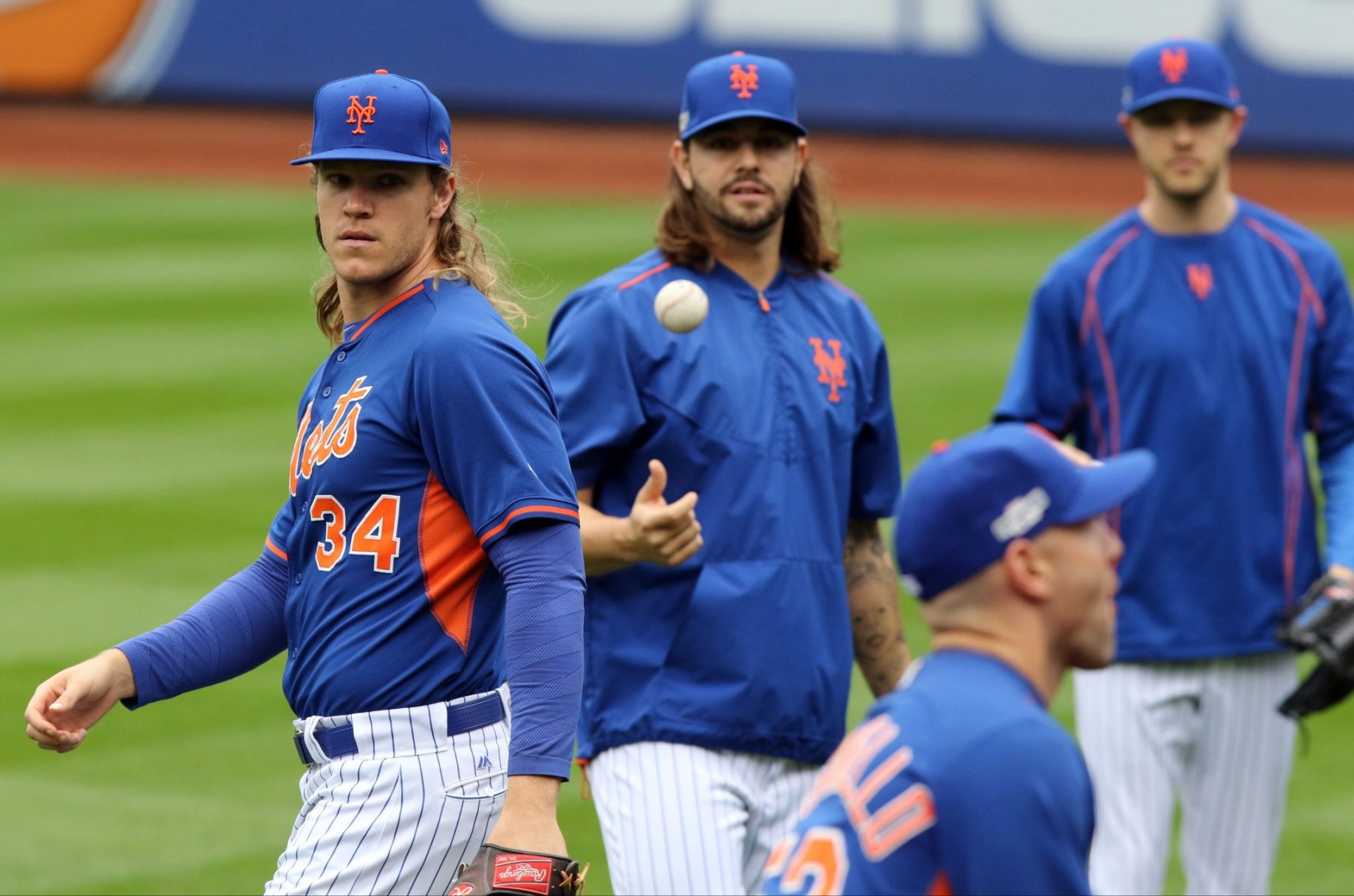 From left, New York Mets starting pitcher Bartolo Colon (40), Mets relief  pitcher Jeurys Familia (27), Mets starting pitcher Noah Syndergaard (34)  and Mets center fielder Yoenis Cespedes (52) pose with their