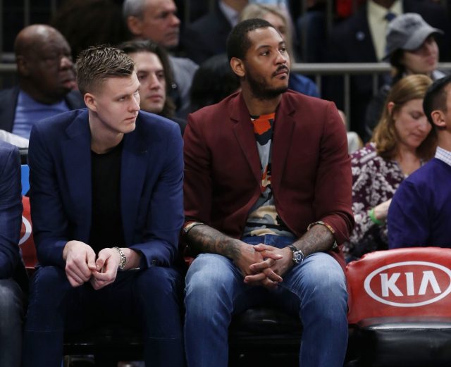 New York Knicks Kristaps Porzingis and Carmelo Anthony walk to the bench  when a the out is called in the second half against the Detroit Pistons at  Madison Square Garden in New