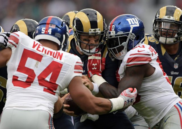 New York Giants defensive end Jason Pierre-Paul (90) knocks the