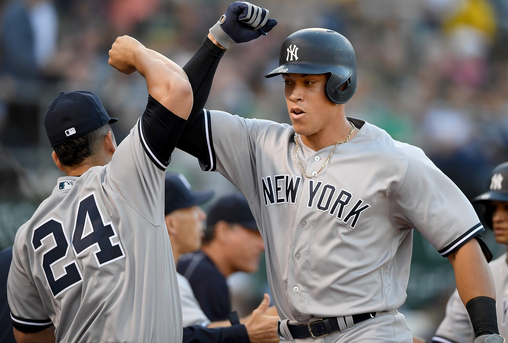 #24 of the New York Yankees celebrate after Judge hit a