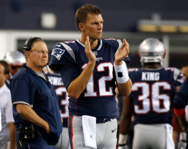 Aug 10, 2017; Foxborough, MA, USA; New England Patriots quarterback Tom  Brady (12), running back Rex Burkhead (34) and teammates warm up before the  start of the game against the Jacksonville Jagua …