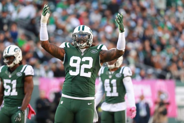 New York Jets Michael Vick celebrates with Calvin Pryor after