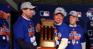 CHICAGO, IL - OCTOBER 21: (L-R) Chief Operating Officer Jeff Wilpon, Chief Executive Officer Saul Katz and Owner Fred Wilpon of the New York Mets pose with the NLCS trophy after defeating the Chicago Cubs in game four of the 2015 MLB National League Championship Series at Wrigley Field on October 21, 2015 in Chicago, Illinois. The Mets defeated the Cubs with a score of 8 to 3 to sweep the Championship Series.