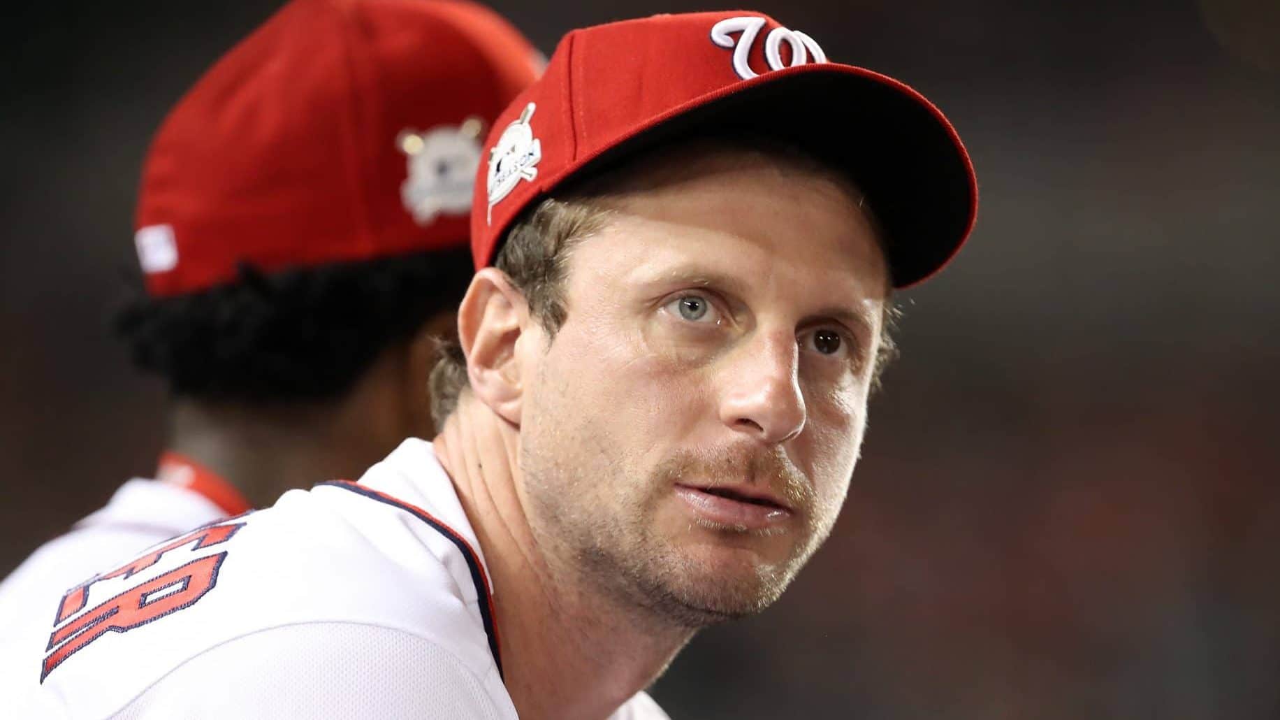 WASHINGTON, DC - OCTOBER 06: Max Scherzer #31 of the Washington Nationals looks on from the dugout in the 4th inning during game one of the National League Division Series against the Chicago Cubs at Nationals Park on October 6, 2017 in Washington, DC.