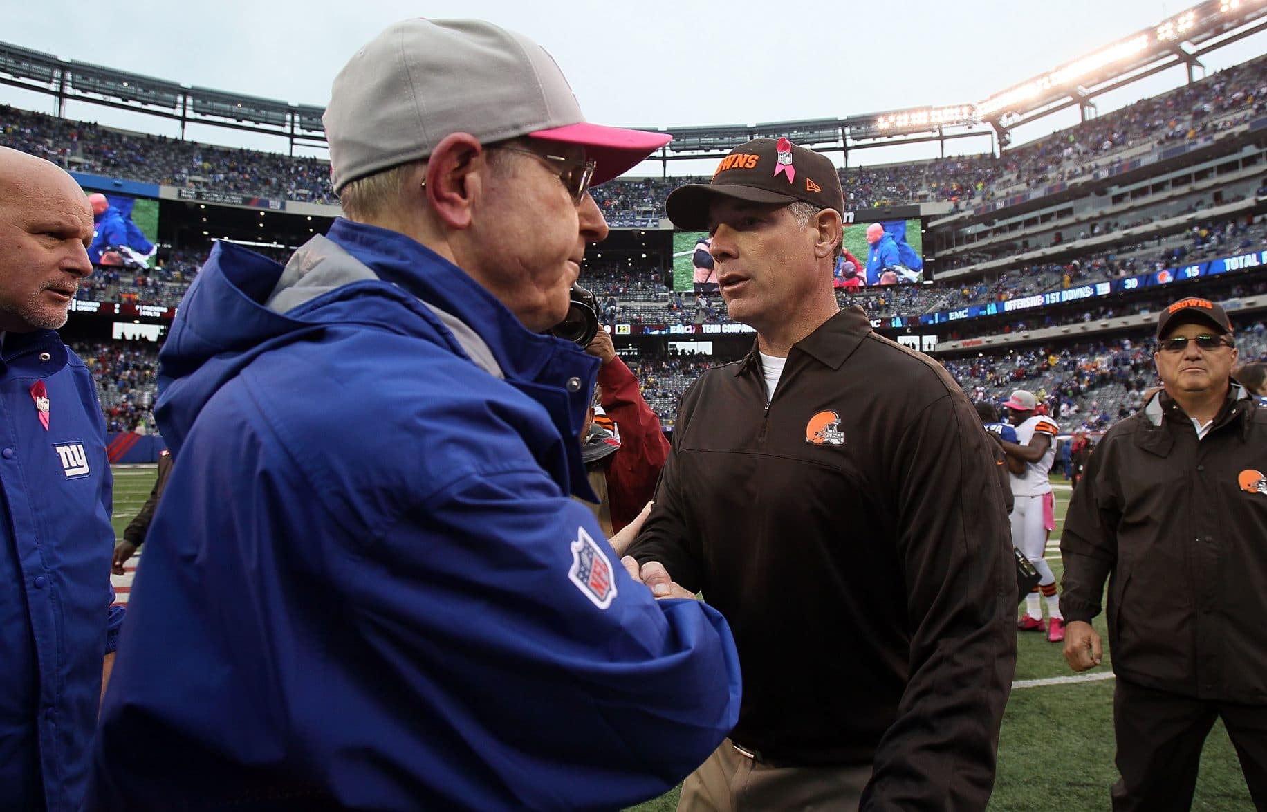 EAST RUTHERFORD, NJ - OCTOBER 07: Cleveland Browns head coach Pat Shurmur meets with New York Giants head coach Tom Coughlin after their game at MetLife Stadium on October 7, 2012 in East Rutherford, New Jersey. 
