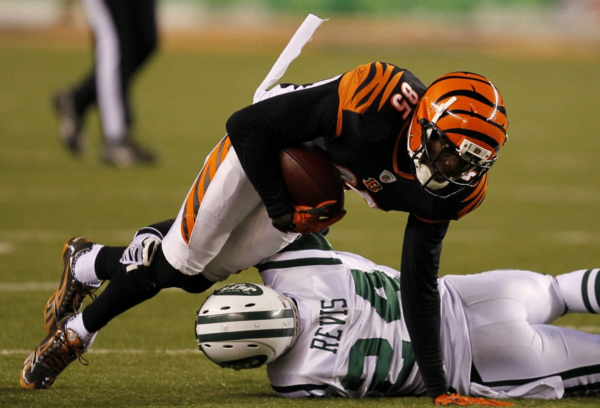 New York Jets Darrelle Revis puts his hand on Cincinnatti Bengals Chad  Ochocinco (85) in a first quarter play in the last regular season football  game ever at Giants Stadium in East