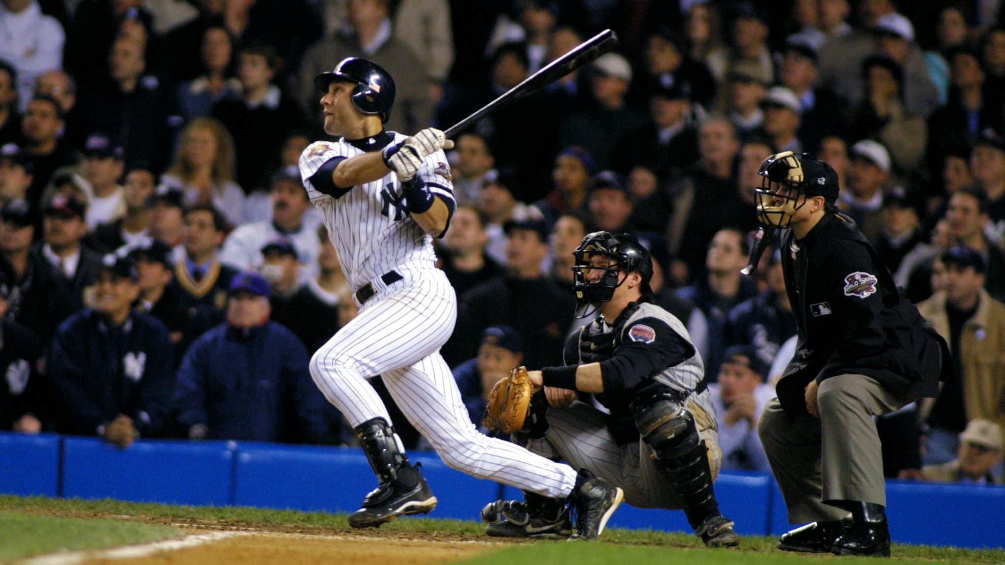 New York Yankees Derek Jeter looks at his bat before stepping into the box  in the first inning against the Philadelphia Phillies in game 2 of the World  Series at Yankee Stadium