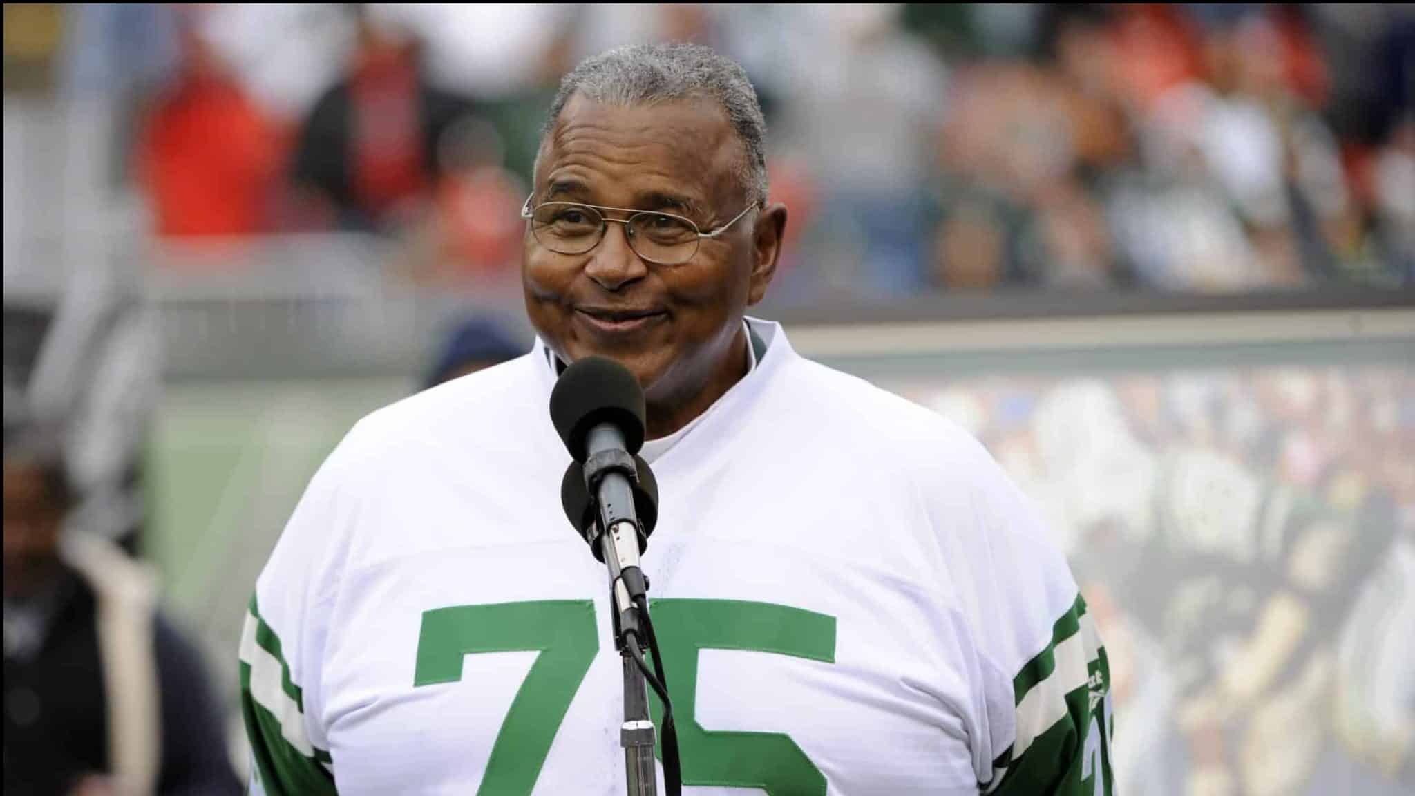 FILE - In this Nov. 1, 2009, file photo, Former New York Jets offensive lineman Winston Hill is honored during halftime of an NFL football game in East Rutherford, N.J. Hill, a durable Pro Bowl offensive tackle who helped protect Joe Namath on the way to the New York Jets' Super Bowl victory in 1969, has died. He was 74. The team announced Tuesday, April 26, 2016, that Hill died in his adopted hometown of Denver.