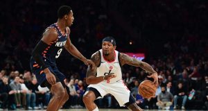 NEW YORK, NEW YORK - DECEMBER 23: Bradley Beal #3 of the Washington Wizards looks to drive past RJ Barrett #9 of the New York Knicks during the first half of their game at Madison Square Garden on December 23, 2019 in New York City. NOTE TO USER: User expressly acknowledges and agrees that, by downloading and or using this photograph, User is consenting to the terms and conditions of the Getty Images License Agreement.