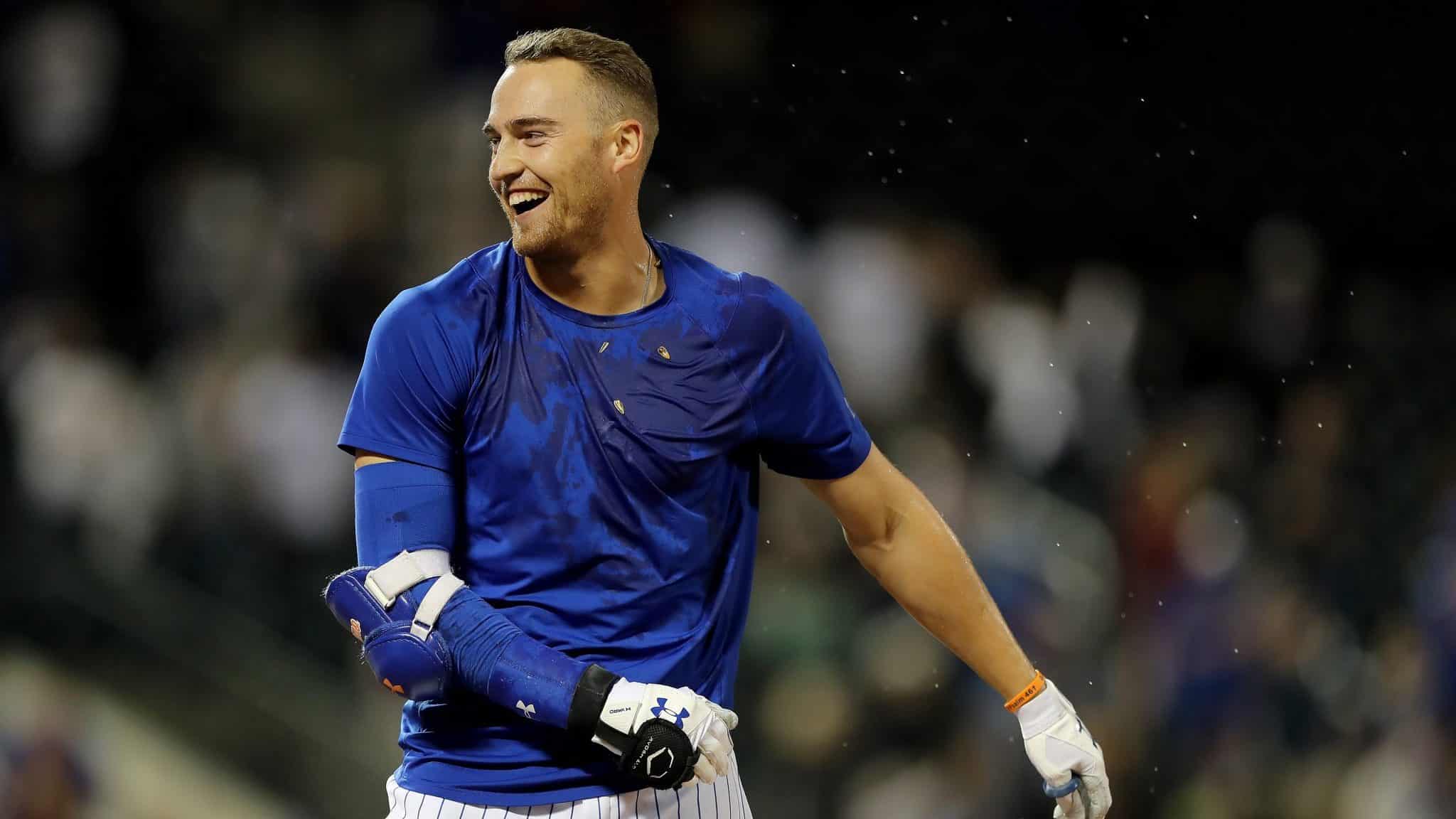 NEW YORK, NEW YORK - SEPTEMBER 24: Brandon Nimmo #9 of the New York Mets celebrates after he was walked with the bases loaded to score the game winning run in the 11th inning against the Miami Marlins at Citi Field on September 24, 2019 in the Flushing neighborhood of the Queens borough of New York City.The New York Mets defeated the Miami Marlins 5-4 in 11 innings.