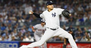 NEW YORK, NEW YORK - OCTOBER 09: Dellin Betances #68 of the New York Yankees throws a pitch against the Boston Red Sox during the seventh inning in Game Four of the American League Division Series at Yankee Stadium on October 09, 2018 in the Bronx borough of New York City.