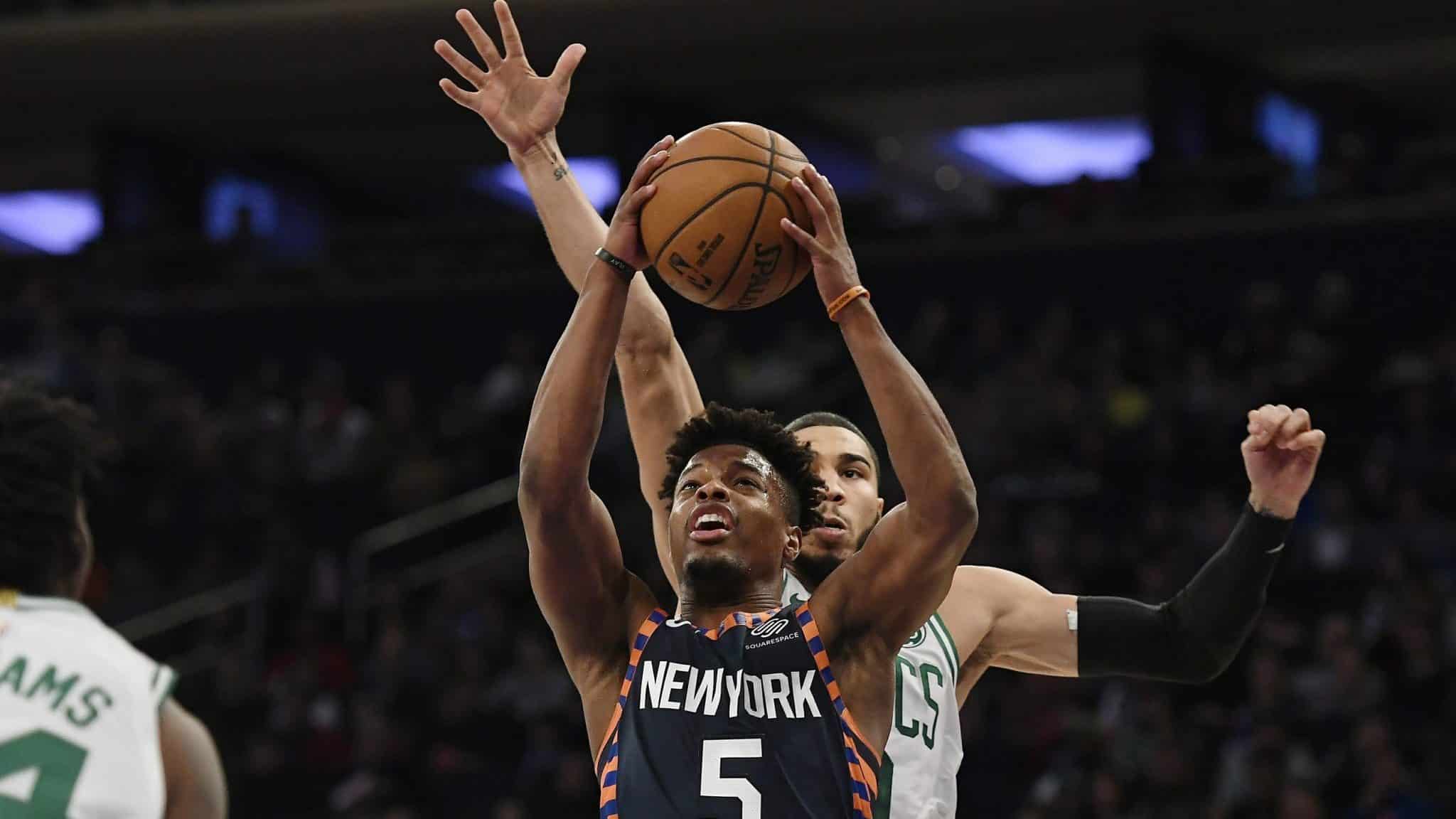 New York Knicks guard Dennis Smith Jr. (5) attempts a basket during the first half of an NBA basketball game against the Boston Celtics, Sunday, Dec. 1, 2019, in New York.