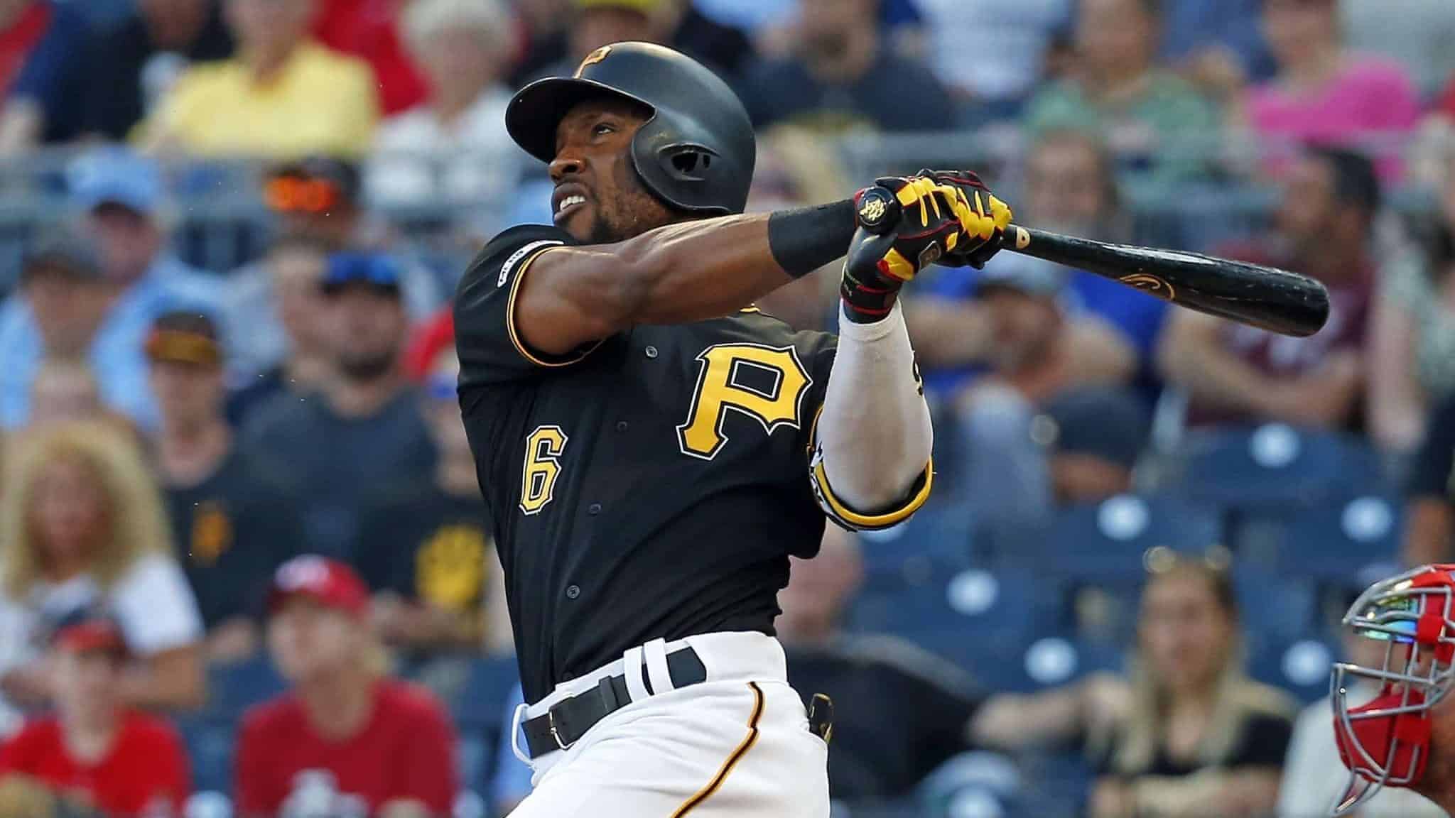 PITTSBURGH, PA - JULY 23: Starling Marte #6 of the Pittsburgh Pirates hits a three-run home run in the first inning against the St. Louis Cardinals at PNC Park on July 23, 2019 in Pittsburgh, Pennsylvania.