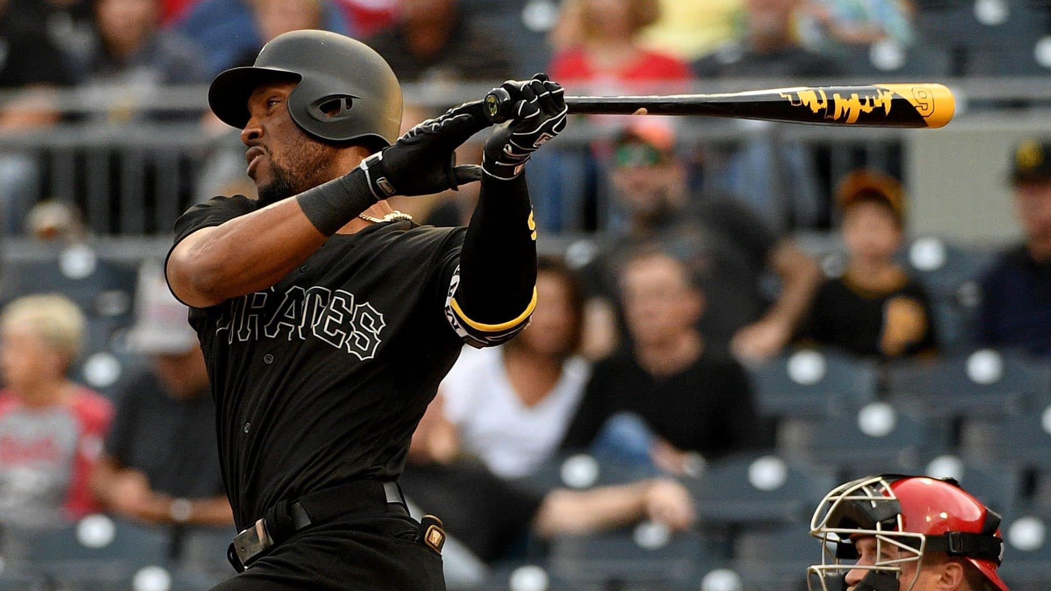 PITTSBURGH, PA - AUGUST 23: Starling Marte #6 of the Pittsburgh Pirates hits a single to center field in the first inning during the game against the Cincinnati Reds at PNC Park on August 23, 2019 in Pittsburgh, Pennsylvania. Teams are wearing special color schemed uniforms with players choosing nicknames to display for Players' Weekend.