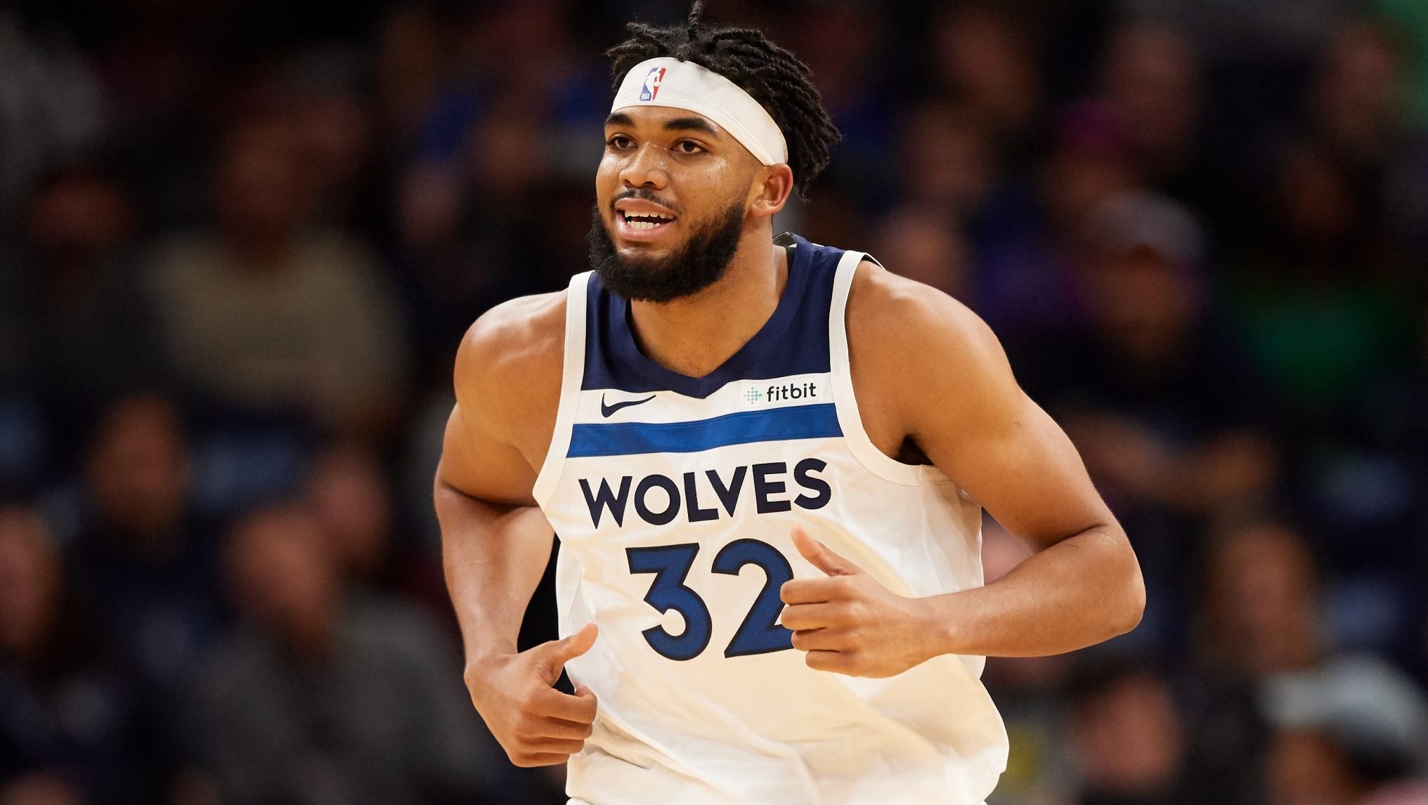 MINNEAPOLIS, MINNESOTA - OCTOBER 27: Karl-Anthony Towns #32 of the Minnesota Timberwolves runs down the court against the Miami Heat during the home opener at Target Center on October 27, 2019 in Minneapolis, Minnesota. The Timberwolves defeated the Heat 116-109. NOTE TO USER: User expressly acknowledges and agrees that, by downloading and or using this Photograph, user is consenting to the terms and conditions of the Getty Images License Agreement.