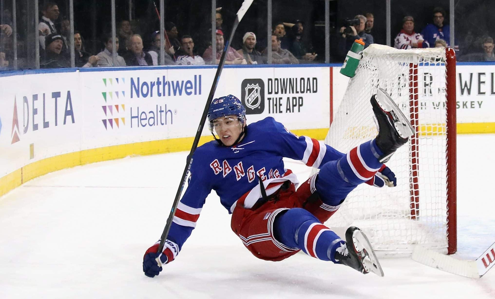 NEW YORK, NEW YORK - NOVEMBER 06: Libor Hajek #25 of the New York Rangers is tripped up by Jimmy Howard #35 of the Detroit Red Wings during the second period at Madison Square Garden on November 06, 2019 in New York City. The Rangers defeated the Red Wings 5-1.