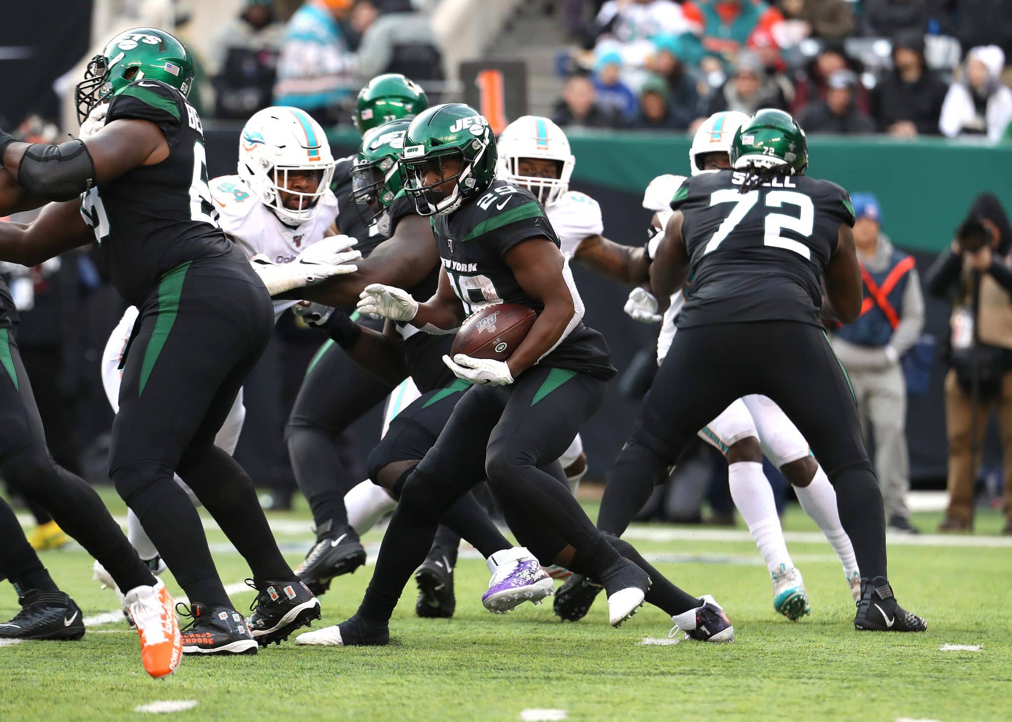 EAST RUTHERFORD, NEW JERSEY - DECEMBER 08: Bilal Powell #29 of the New York Jets runs against the Miami dolphins during their game at MetLife Stadium on December 08, 2019 in East Rutherford, New Jersey.