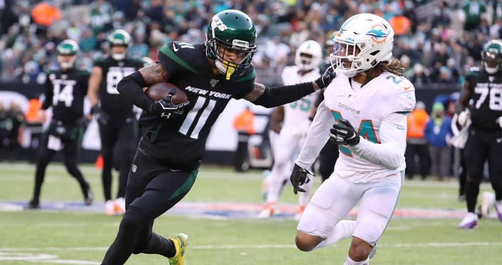 EAST RUTHERFORD, NEW JERSEY - DECEMBER 08: Robby Anderson #11 of the New York Jets runs against Ryan Lewis #24 of the Miami Dolphins during their game at MetLife Stadium on December 08, 2019 in East Rutherford, New Jersey.