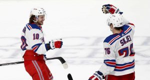 SAN JOSE, CALIFORNIA - DECEMBER 12: Artemi Panarin #10 of the New York Rangers is congratulated by Brady Skjei #76 after he scored an empty net goal against the San Jose Sharks for his third goal of the game at SAP Center on December 12, 2019 in San Jose, California.