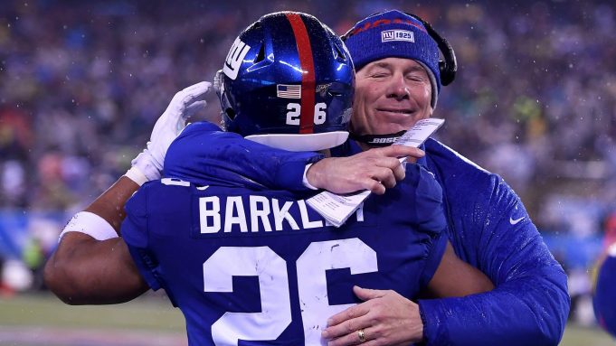 EAST RUTHERFORD, NEW JERSEY - DECEMBER 29: Saquon Barkley #26 of the New York Giants celebrates with head coach Pat Shurmur after scoring a 68 yard touchdown against the Philadelphia Eagles during the third quarter in the game at MetLife Stadium on December 29, 2019 in East Rutherford, New Jersey.